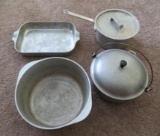 Four pieces of aluminum cookware
