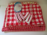 Four red and white print table clothes and two blind dusters