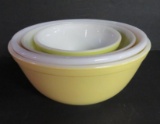 Nest of three pyrex bowls and white milk glass mixing bowl
