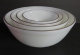 Four bowl nest of Pyrex mixing bowls, milk glass with gold trim