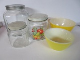 Vintage kitchen lot, three glass storage jars and two yellow pyrex mixing bowls