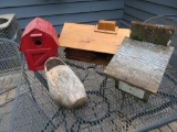 Three wooden birdhouses and wooden shoe