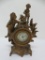 Bronze patinaNew Haven figural clock with woman and cherub, 9 1/2