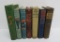 Seven vintage military themed books, pictorial covers and bindings