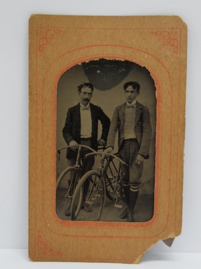 Early tin type with two bicyclists, 3 1/2" x 2 1/2"