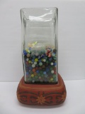 Large lot of machine made marbles in a great glass jar with pottery base