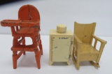 Three cast iron doll house pieces, miniatures, high chair, rocking chair and refrigerator