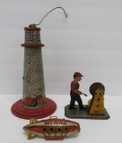 Vintage tin toys, Girard grinder man and partial Sky Flyer tin toy