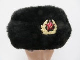 Soviet emblem and fur hat with blasting cap tin