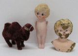Vintage toy lot with wind up camel, tin doll head and Japan bisque doll
