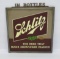 Reverse painted Schlitz glass sign with plastic lettering topper