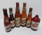Six Schlitz beer bottles, varied size and label style