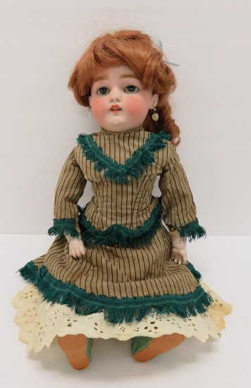Antique bisque head and shoulder doll with leather body, 16"