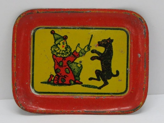 Antique Cracker Jack toy, metal tin, clown and dog, 2 1/4" x 1 3/4"