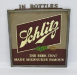 Reverse painted Schlitz glass sign with plastic lettering topper