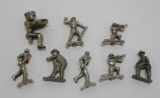 8 Nickel plated and metal Arcade figures, 1 1/2