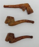 Three early clay Cracker Jack toy prize pipes, 2 1/2