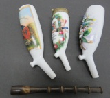 Three porcelain decorated pipe bowls and one pipe stem (unmatched), 4 1/2