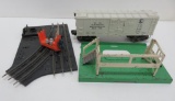 Lionel refrigerator milk car, milk cap platform, and track cleaner