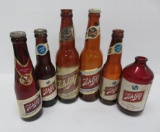 Six Schlitz beer bottles, varied size and label style