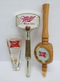 Three Miller tap handles, 6