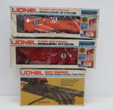 Two Lionel train cars with boxes and right hand remote control switch