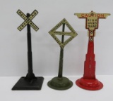 Three metal railroad crossing signs, train lay out accessories, 7 1/2