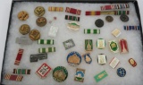 41 military hat badges, campaign ribbons, and pins