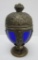 Ornate covered candy dish, cobalt glass interior, ornate fruit and nut decor on metal