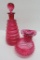 3 pieces of Cranberry glass, hobnail and ribbed castor