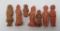 Seven red clay Cracker Jack toy prizes, 1 1/2