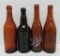 4 early Schlitz embossed beer bottles, 9 1/2