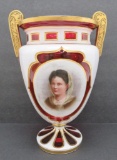 Cranberry glass portrait vase, metal handles and gold trim, white cut to cranberry