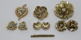 Three gold tone pin and earring sets and bar pin