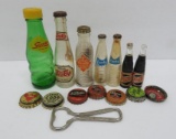 Miniature soda bottles and bottle caps