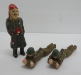 Three large composition type toy soldiers, 6