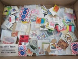 About 200 paper Cracker Jack toys
