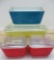 Five primary colored Pyrex refrigerator dishes