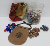 About 250 vintage marbles, with vintage marble bags