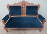 Heavily Carved Walnut Loveseat with Heron Rosette