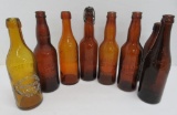 7 amber Schlitz, Milwaukee Lager bottles and one Graf's, 9 1/2