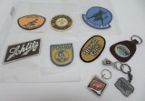 Six vintage beer shirt patches, tie bar and key chains