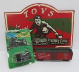Toy train sign, model car and whistle