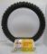 Dunlop motorcycle tire display with tire and metal stand