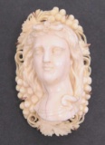 Carved bone cameo pendant with 9 kt gold frame, 2 1/4