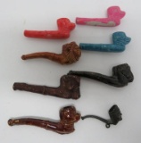 Stoneware, plaster, and metal bubble pipes, Cracker Jack toys