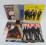 Nine vintage Rock and Roll 45 rpm picture sleeves and records