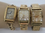Three Elgin 10 k gold filled men's and woman wristwatches