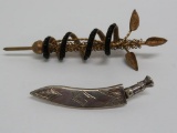 Two very interesting pins, snake and staff and sword in sheath