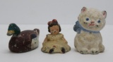 Three cast iron figures, cat, duck and doll